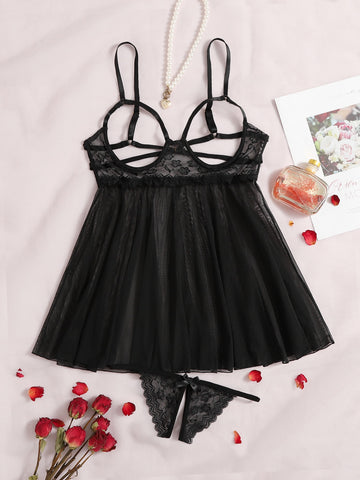 Women's black sheer mesh babydoll lingerie set with cut-out detail, adjustable spaghetti straps, triangle cups, and matching low-rise thong.