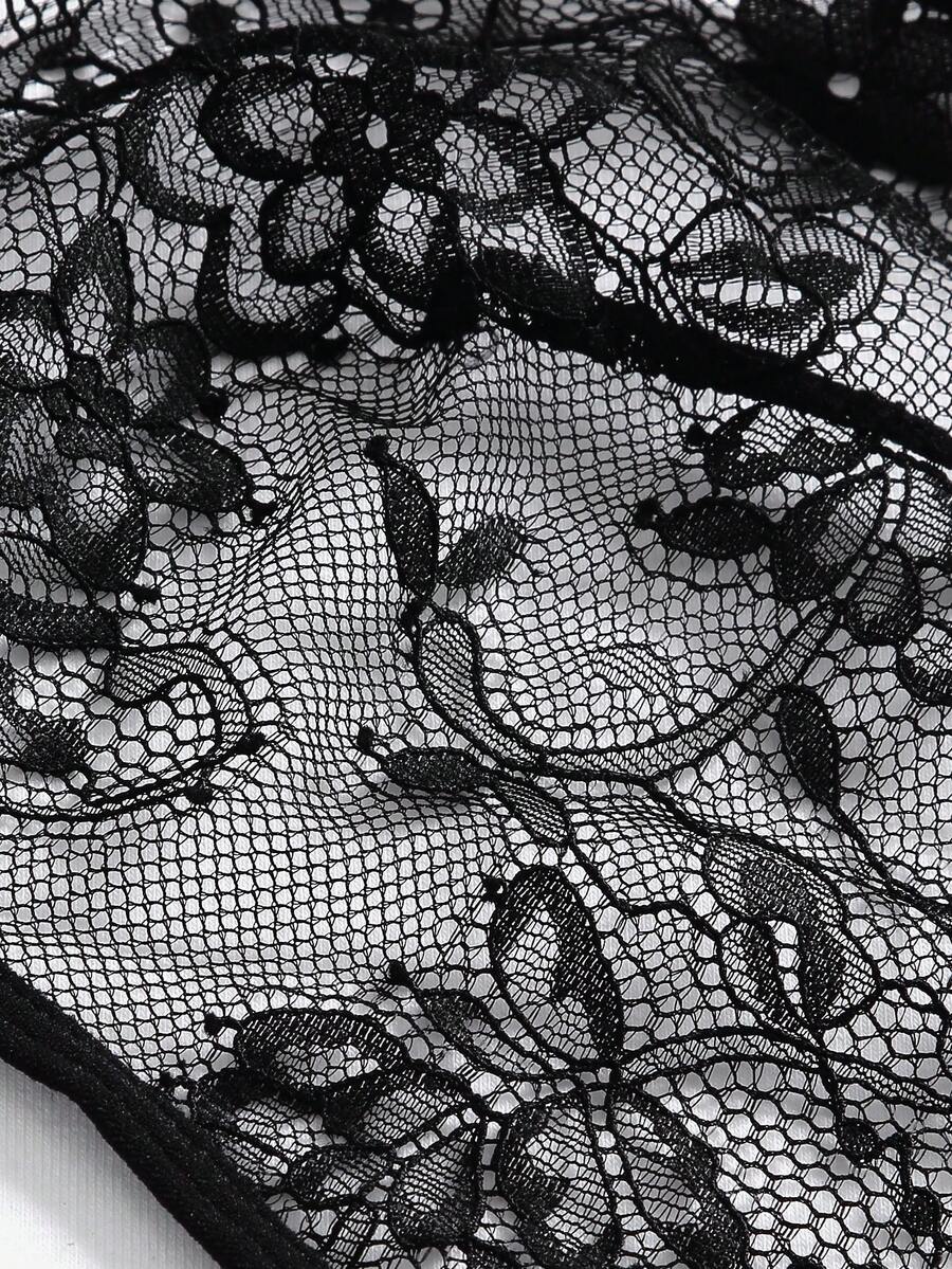Black floral lace cut-out teddy bodysuit lingerie featuring backless criss-cross design and adjustable spaghetti straps.