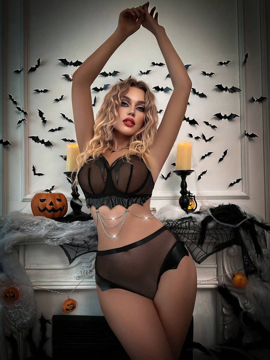 Black goth mesh lingerie set featuring a halter cut out bralette with adjustable straps and matching mid rise briefs for Halloween.