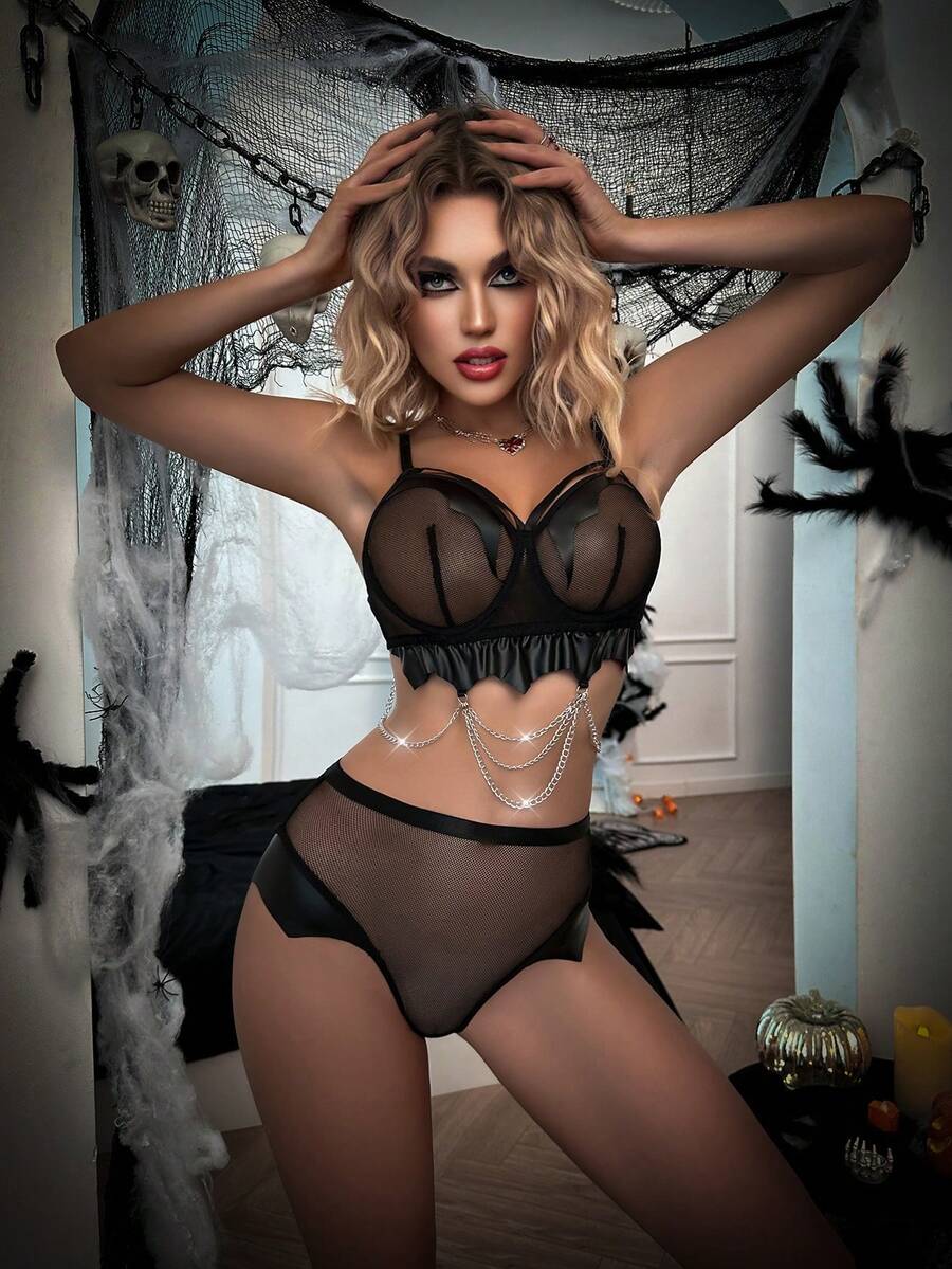 Black goth mesh lingerie set featuring a halter cut out bralette with adjustable straps and matching mid rise briefs for Halloween.