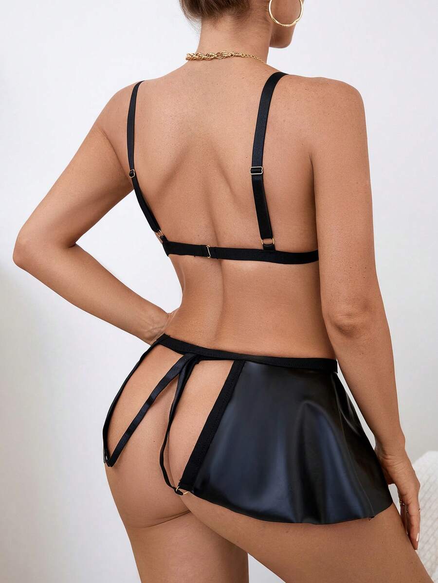 Black 3-piece goth lingerie set featuring a cutout wireless bralette with adjustable spaghetti straps, bow and knot details, paired with a matching low-rise V-string panty and short skirt.