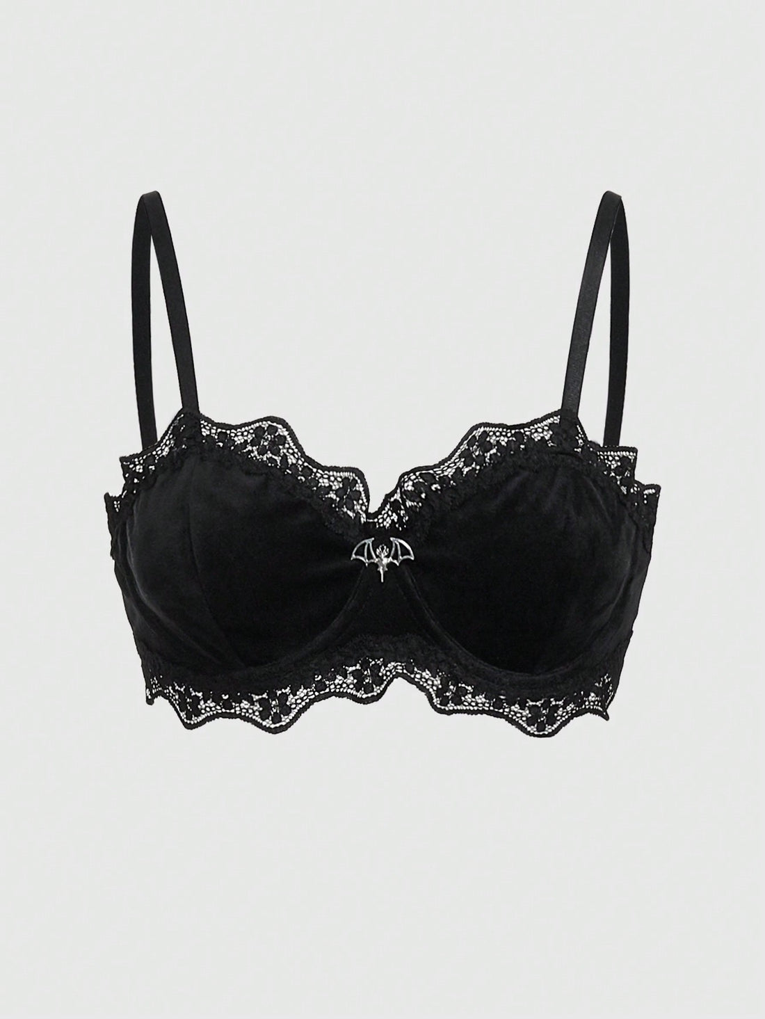 Black velvet and contrast lace underwire bralette featuring a bat shaped pendant, bow detail, adjustable spaghetti straps, and floral pattern.