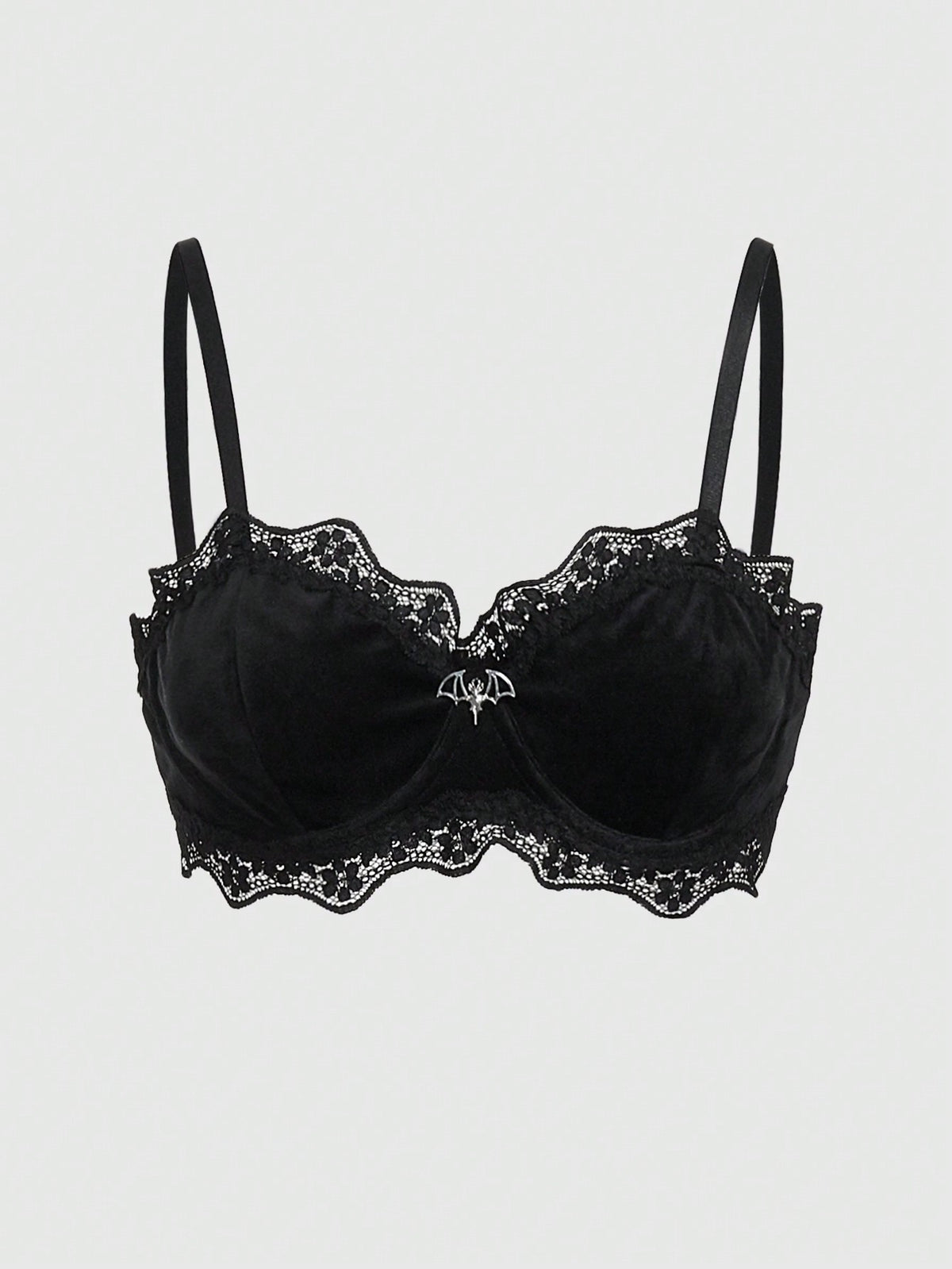 Black velvet and contrast lace underwire bralette featuring a bat shaped pendant, bow detail, adjustable spaghetti straps, and floral pattern.
