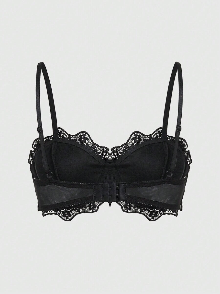 Black velvet and contrast lace underwire bralette featuring a bat shaped pendant, bow detail, adjustable spaghetti straps, and floral pattern.