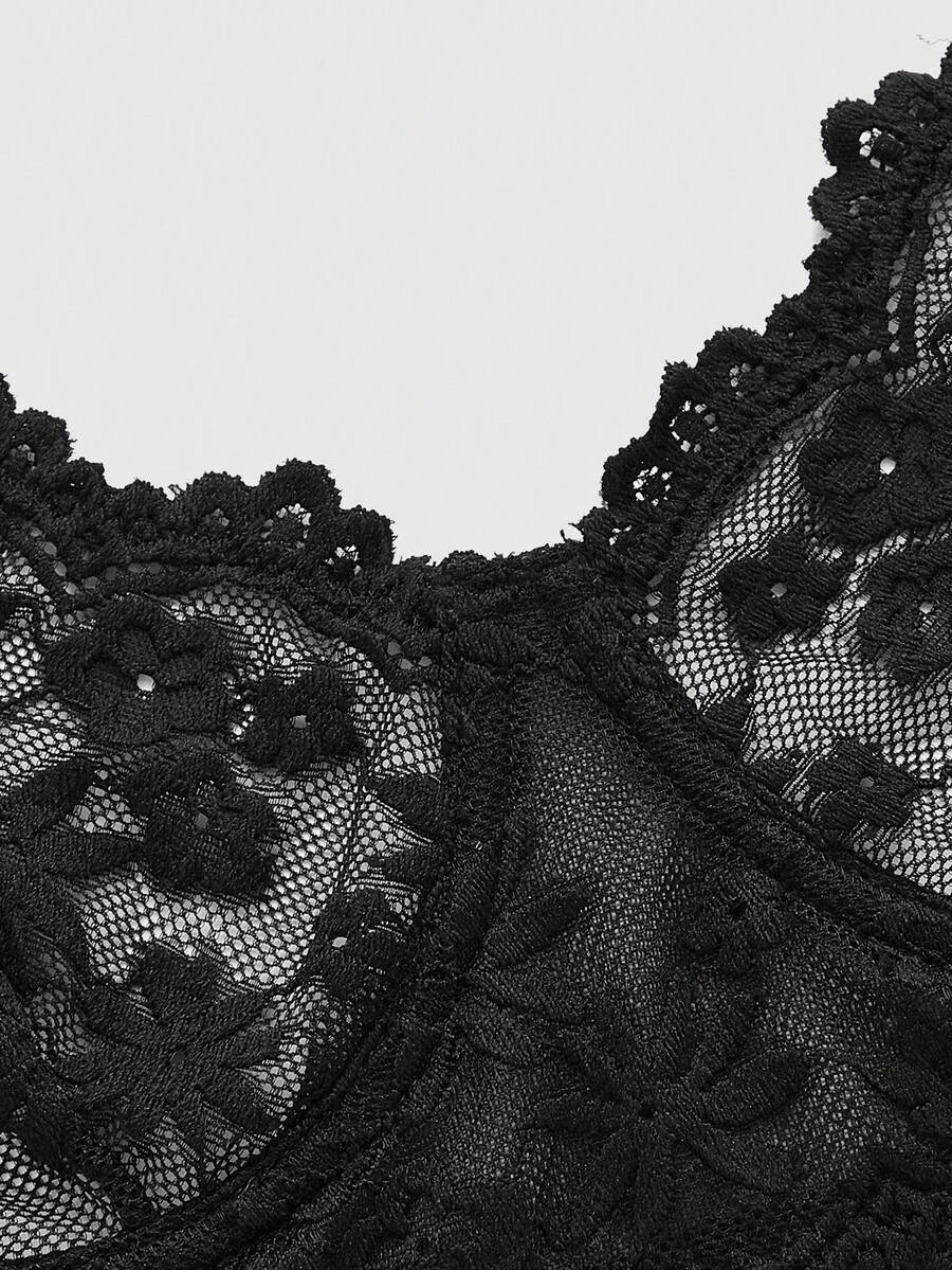 Front view of black Goth longline bra with contrast sheer lace, underwire, and adjustable straps