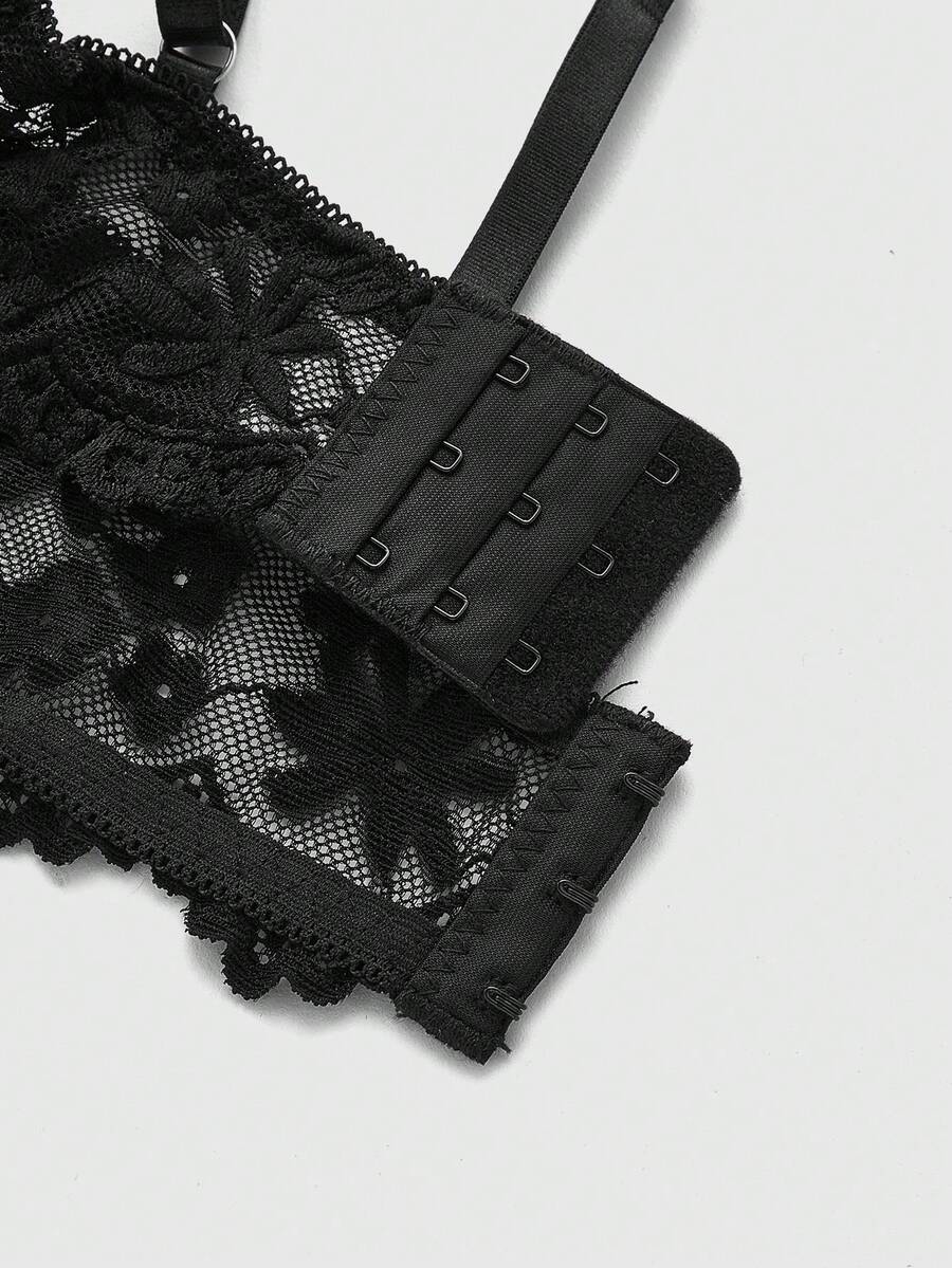 Front view of black Goth longline bra with contrast sheer lace, underwire, and adjustable straps