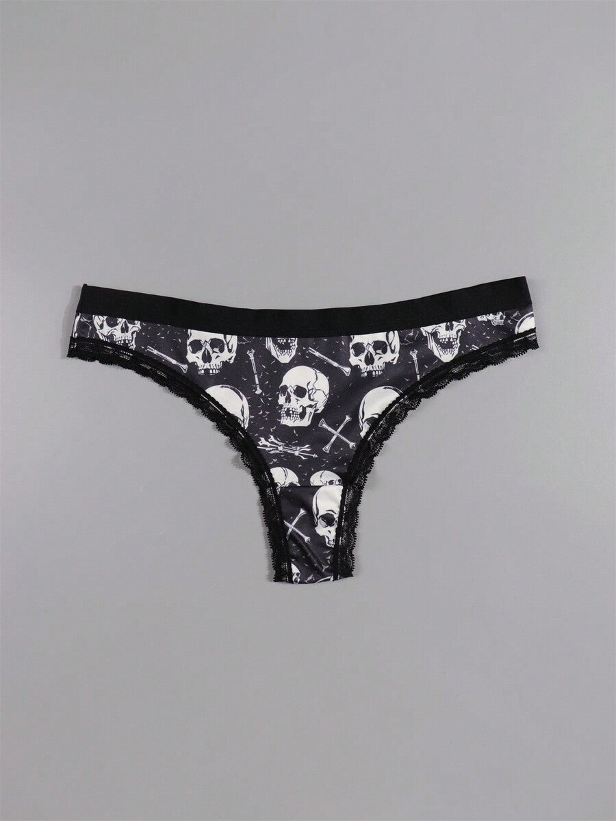 Four-piece women's gothic low rise thongs set with contrast lace trim and multicolor Halloween skull print.