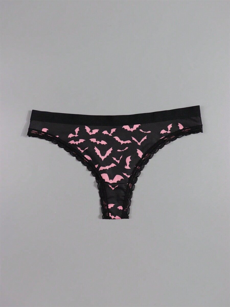 Four-piece women's gothic low rise thongs set with contrast lace trim and multicolor Halloween skull print.