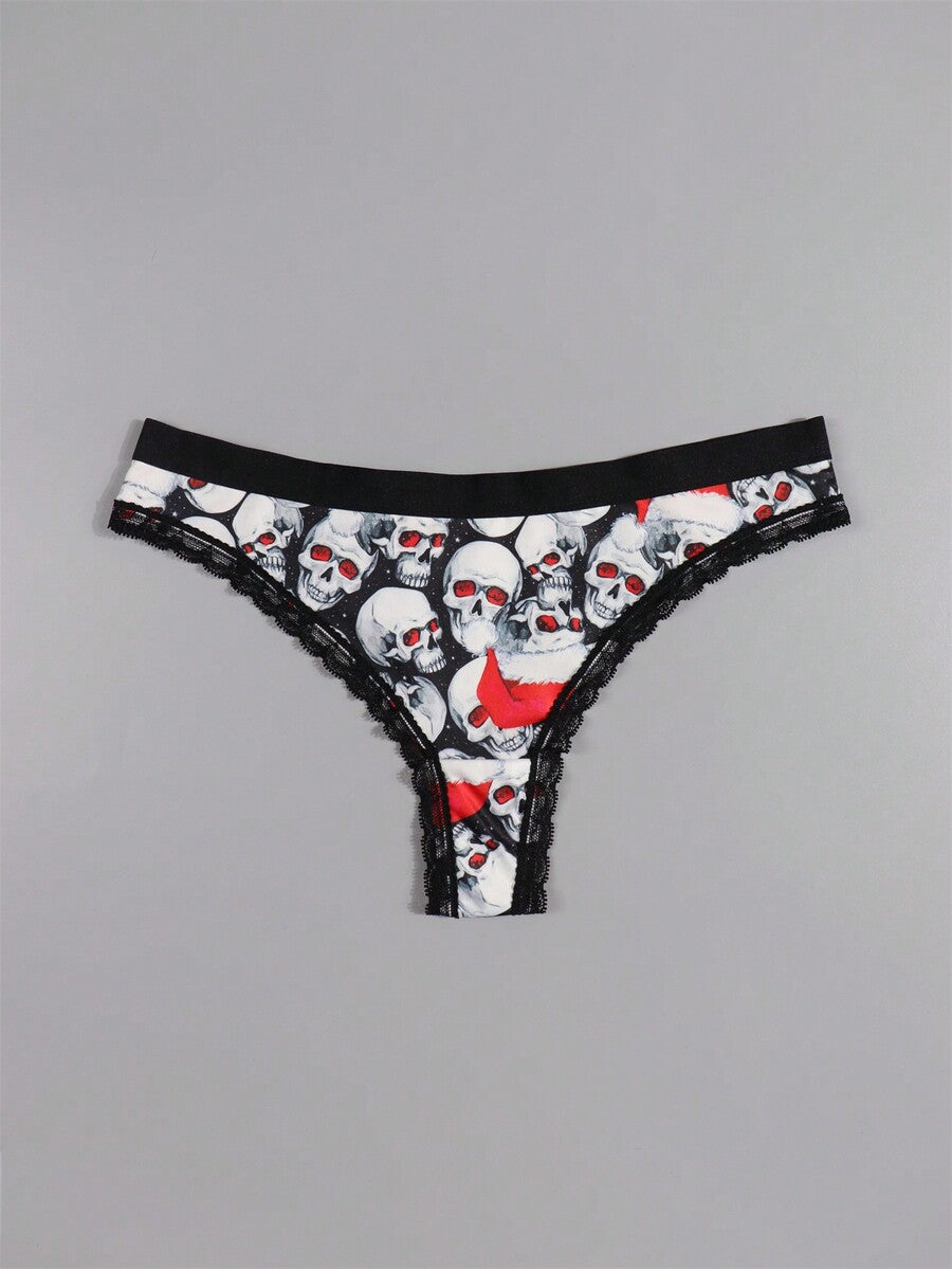 Four-piece women's gothic low rise thongs set with contrast lace trim and multicolor Halloween skull print.