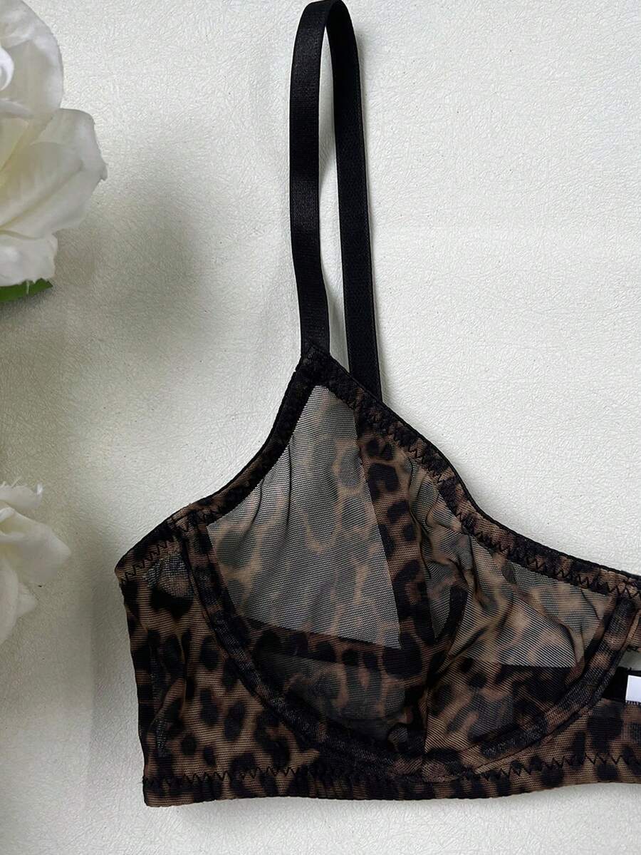 Women's black 2-piece sheer mesh lingerie set featuring an underwire bralette top with cut-out bow details and a matching thong.