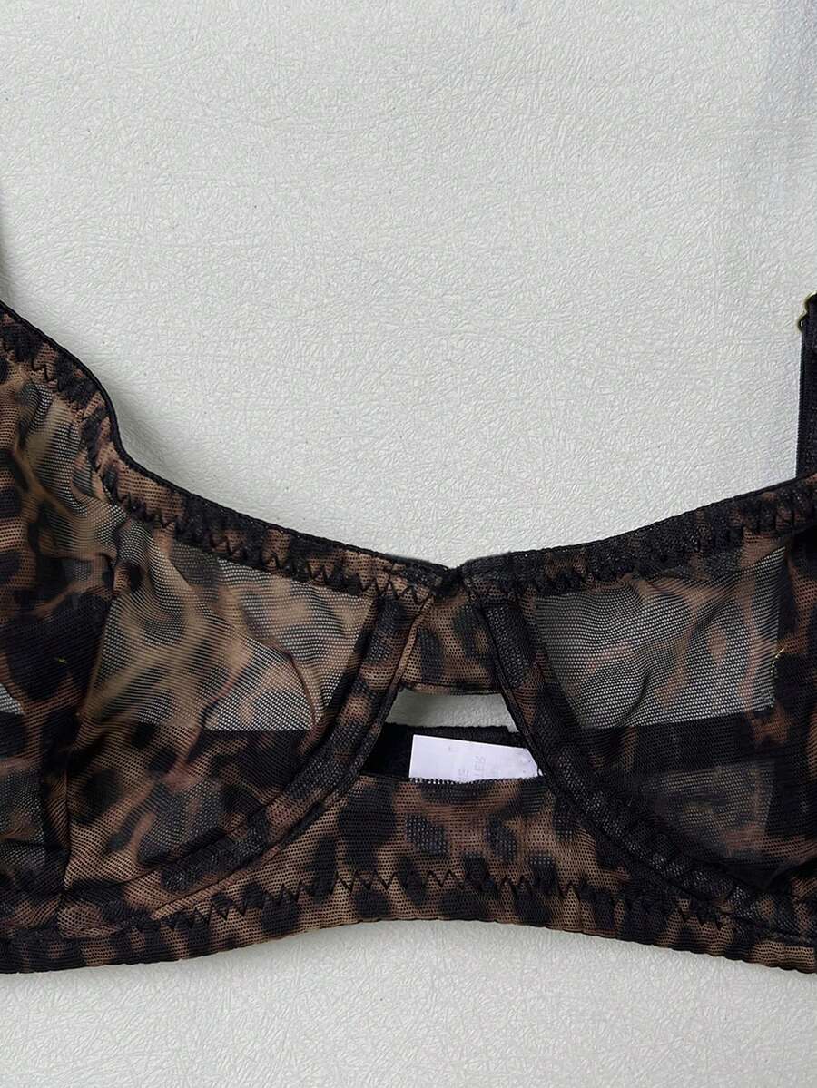 Women's black 2-piece sheer mesh lingerie set featuring an underwire bralette top with cut-out bow details and a matching thong.
