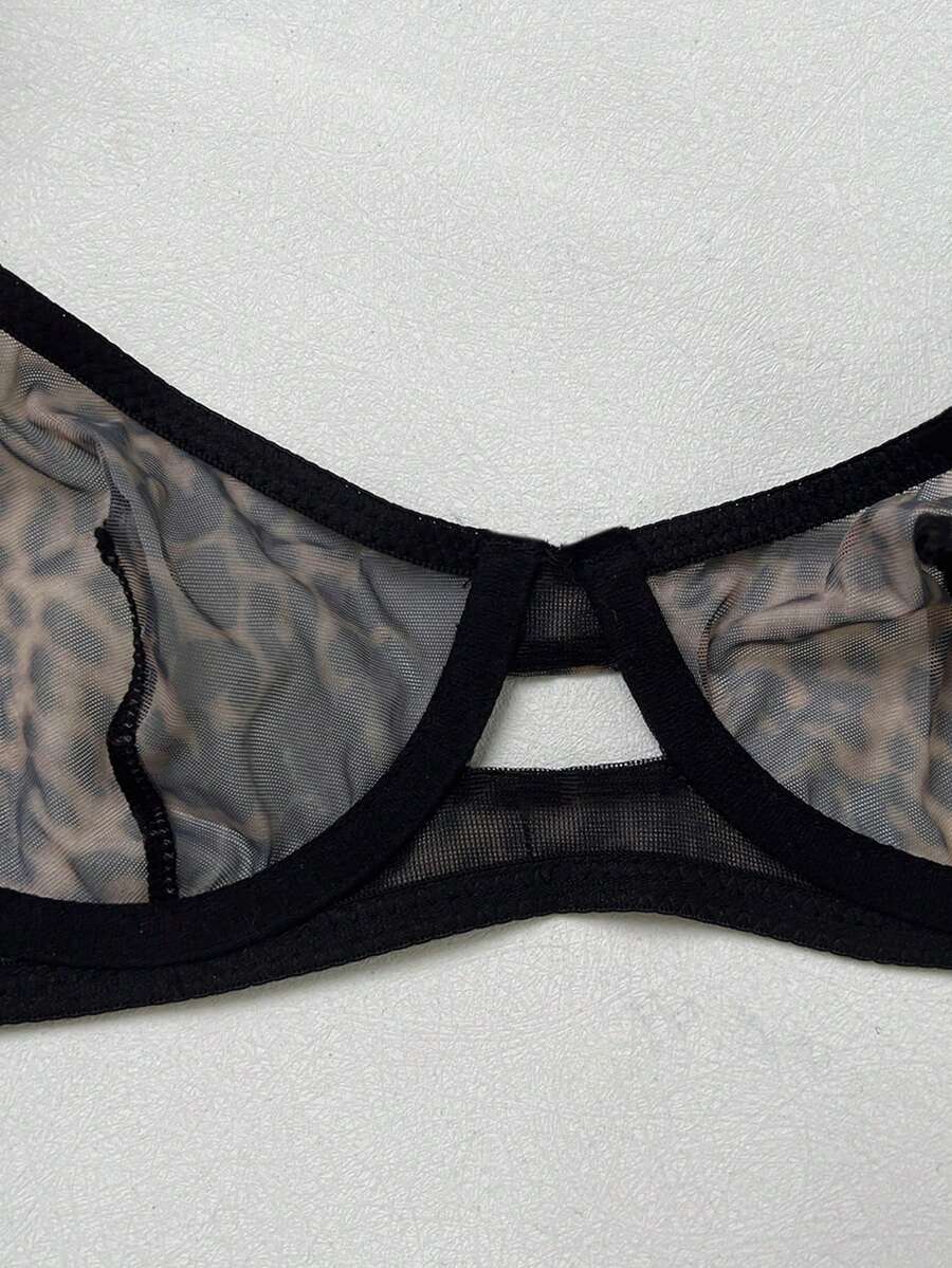 Women's black 2-piece sheer mesh lingerie set featuring an underwire bralette top with cut-out bow details and a matching thong.