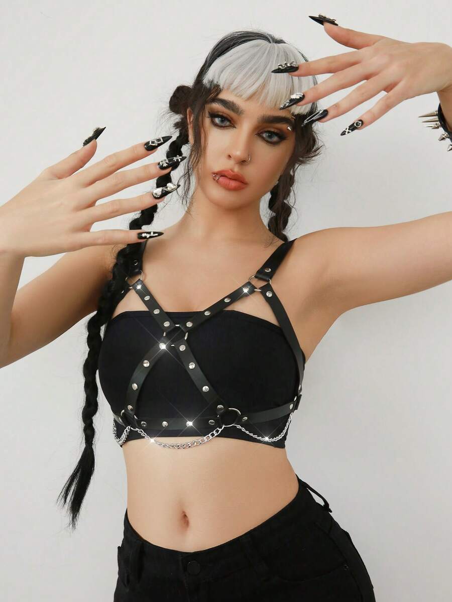 Women's black goth PVC leather strappy harness bra top featuring chain accents and lace-up details.