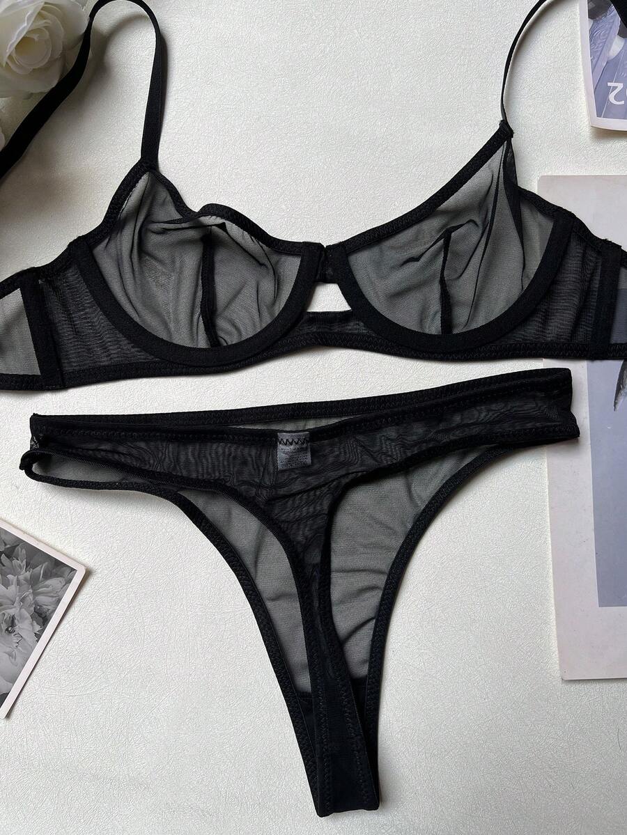 Women's black 2-piece sheer mesh lingerie set featuring an underwire bralette top with cut-out bow details and a matching thong.