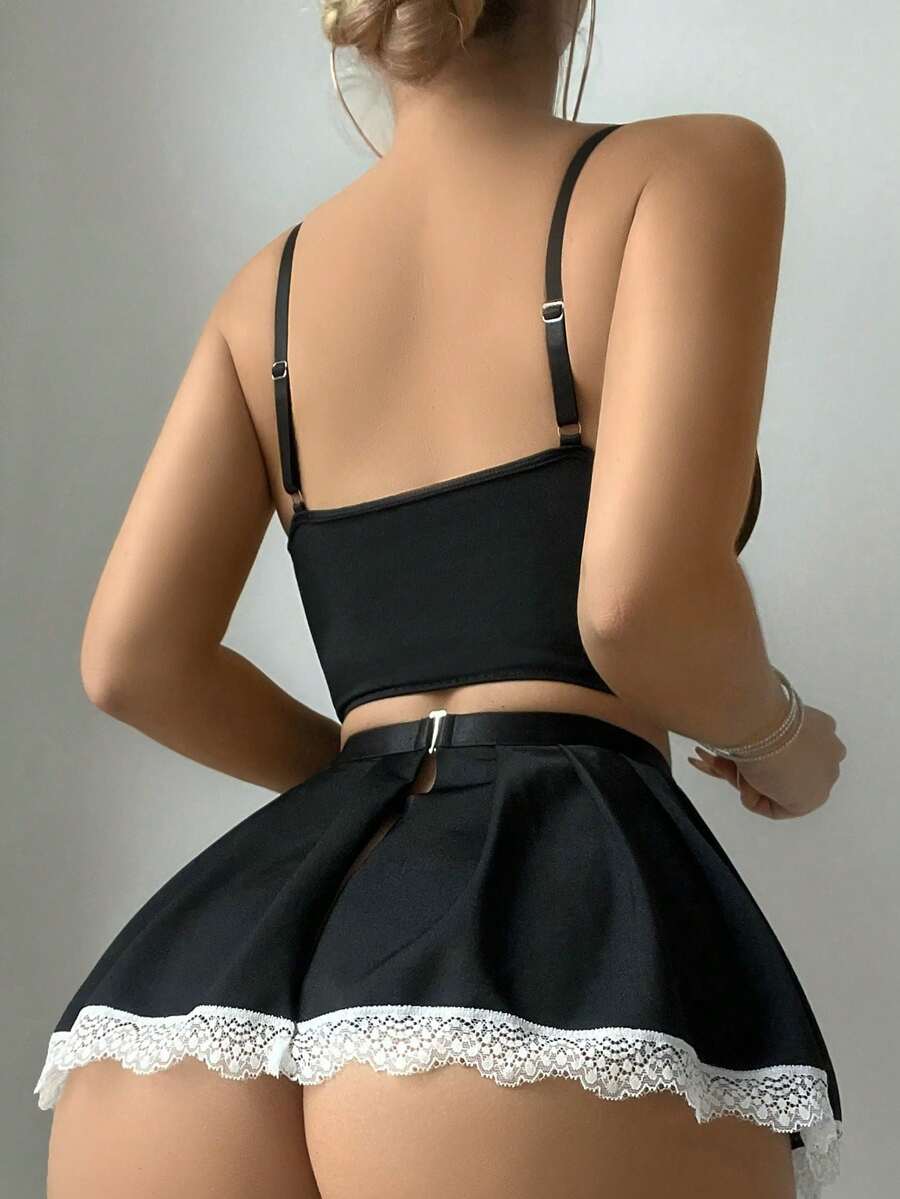 5-piece black and white women's lingerie set featuring an underwire bra, thong, garter belt, and two bowknot leg garters with lace-up details.