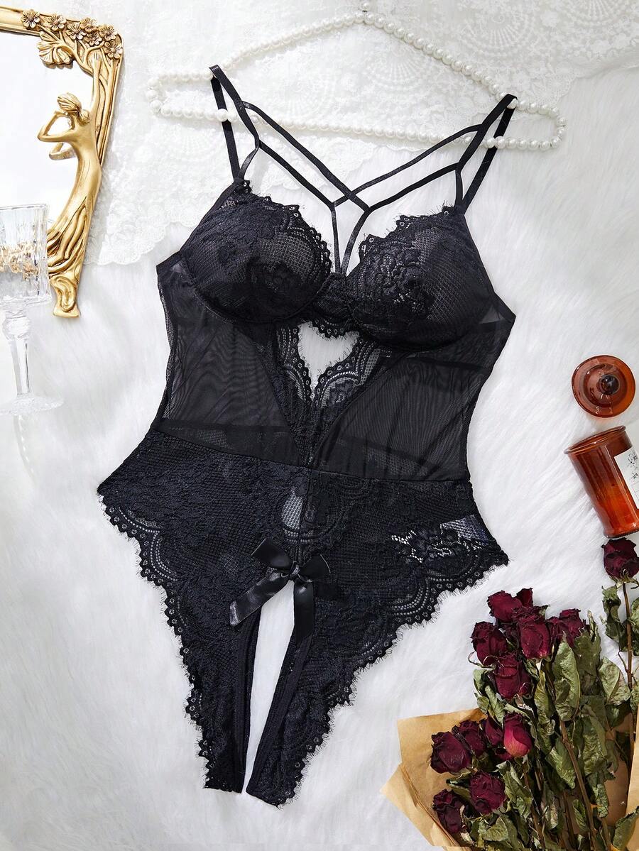 Black floral lace crotchless teddy bodysuit featuring harness style cutouts, push-up cups, adjustable spaghetti straps, and a thong back.