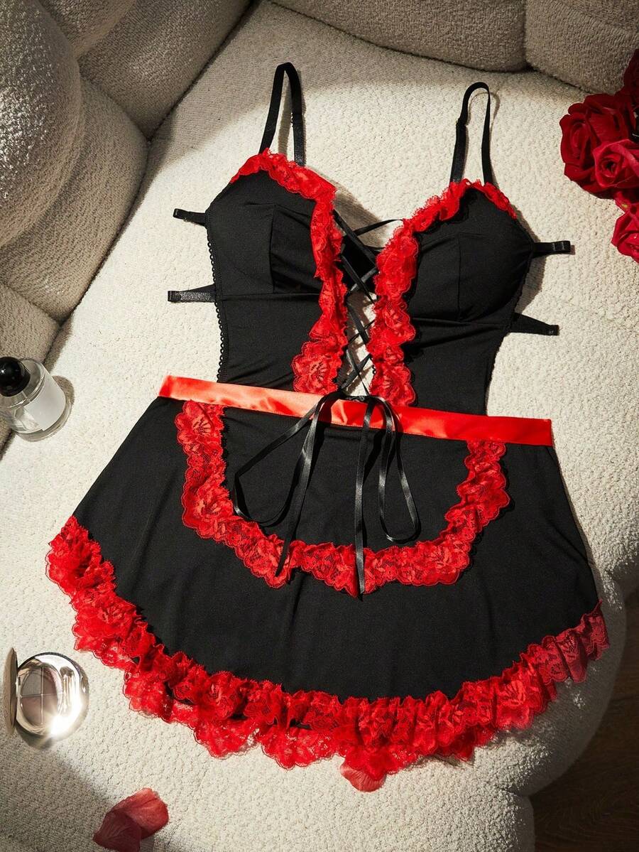 Black 2-piece sexy maid cosplay costume set for women, featuring a spaghetti strap jumpsuit with lace-up criss-cross details and a matching apron.