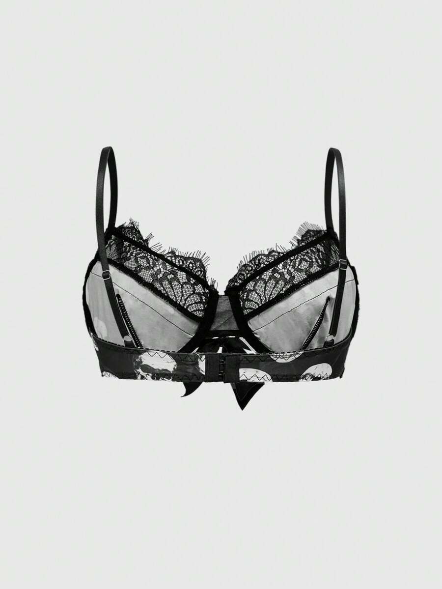 Black dark gothic skull print lingerie bra featuring contrast lace trim, bow accent, underwire balconette cups, and adjustable shoulder straps.