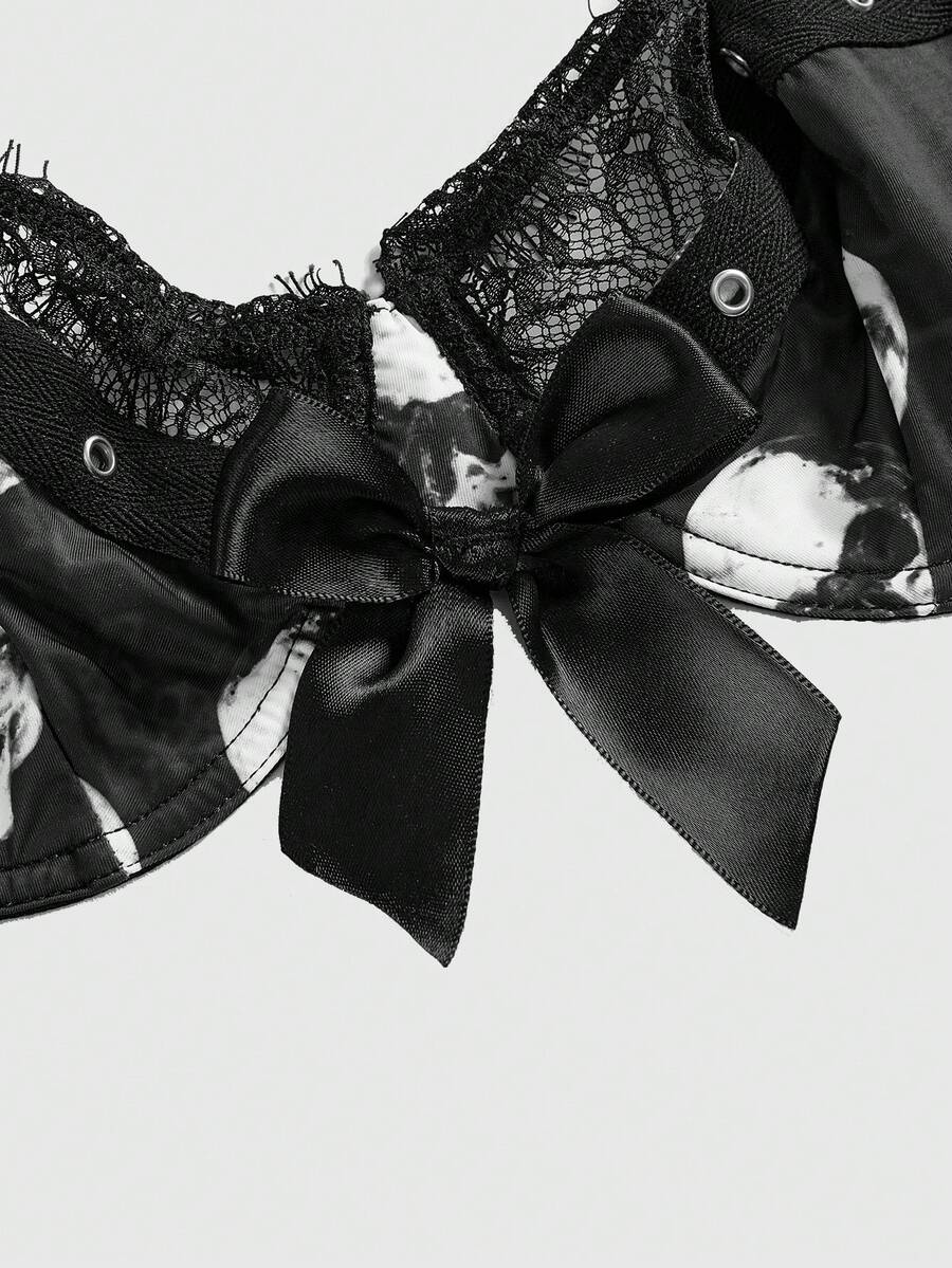 Black dark gothic skull print lingerie bra featuring contrast lace trim, bow accent, underwire balconette cups, and adjustable shoulder straps.