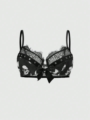 Black dark gothic skull print lingerie bra featuring contrast lace trim, bow accent, underwire balconette cups, and adjustable shoulder straps.