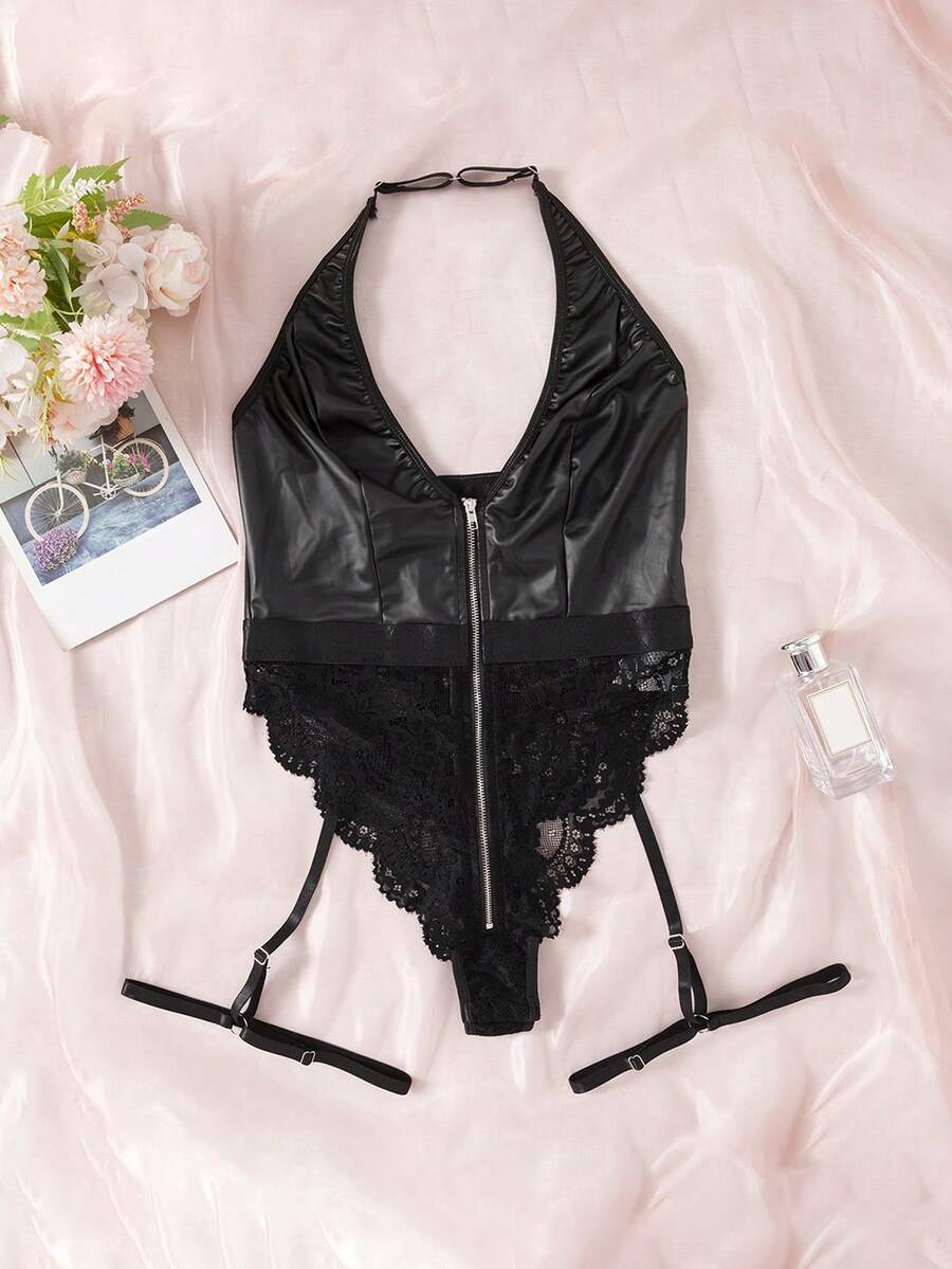Women's black lace and PU leather patchwork teddy bodysuit featuring a front zipper, halter neck, and backless crossback straps.