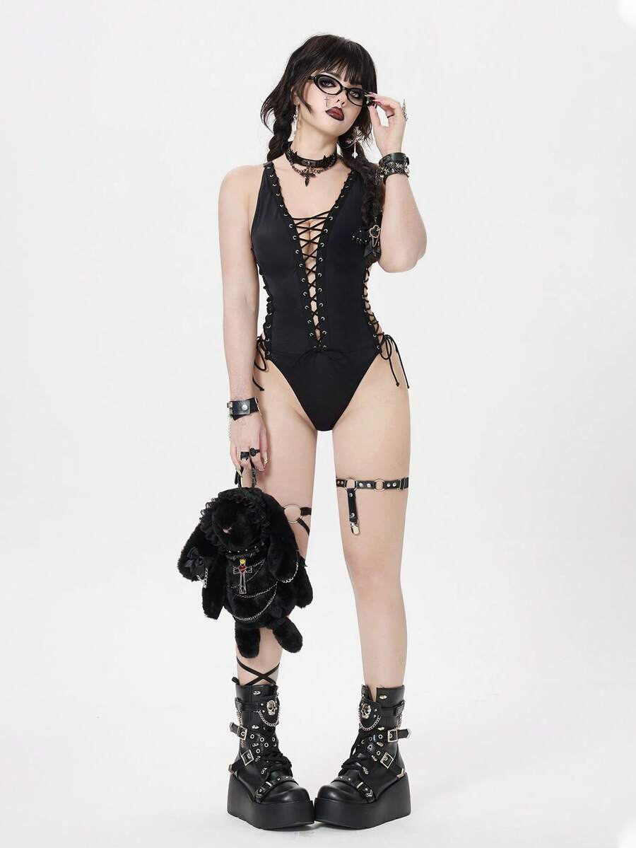Women's black goth style one-piece swimsuit featuring a halter neck, front criss-cross lace-up detail, and backless design.