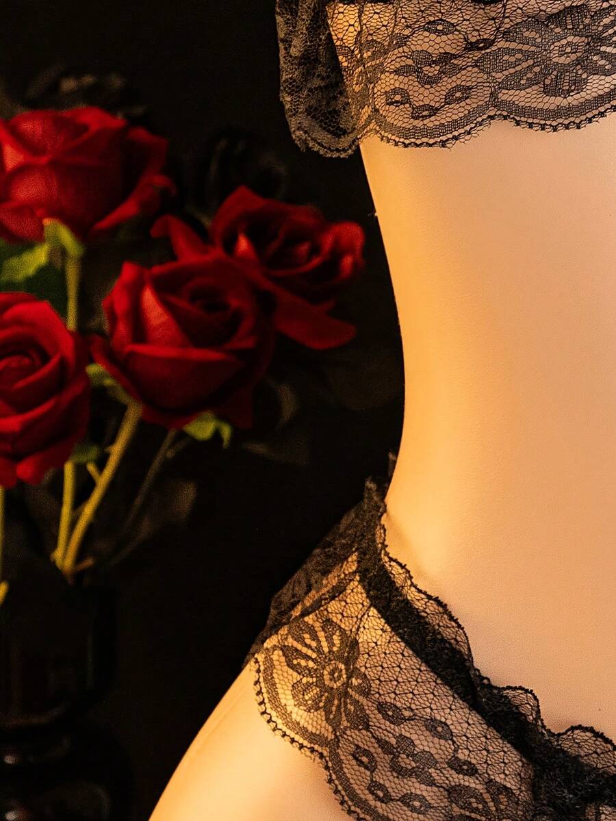 Black sheer backless lingerie set featuring a wireless bralette with adjustable spaghetti straps and a low-rise thong.