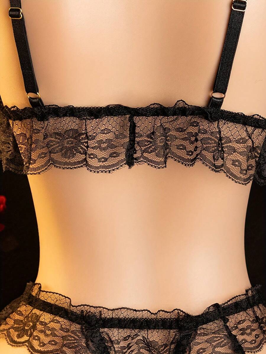 Black sheer backless lingerie set featuring a wireless bralette with adjustable spaghetti straps and a low-rise thong.