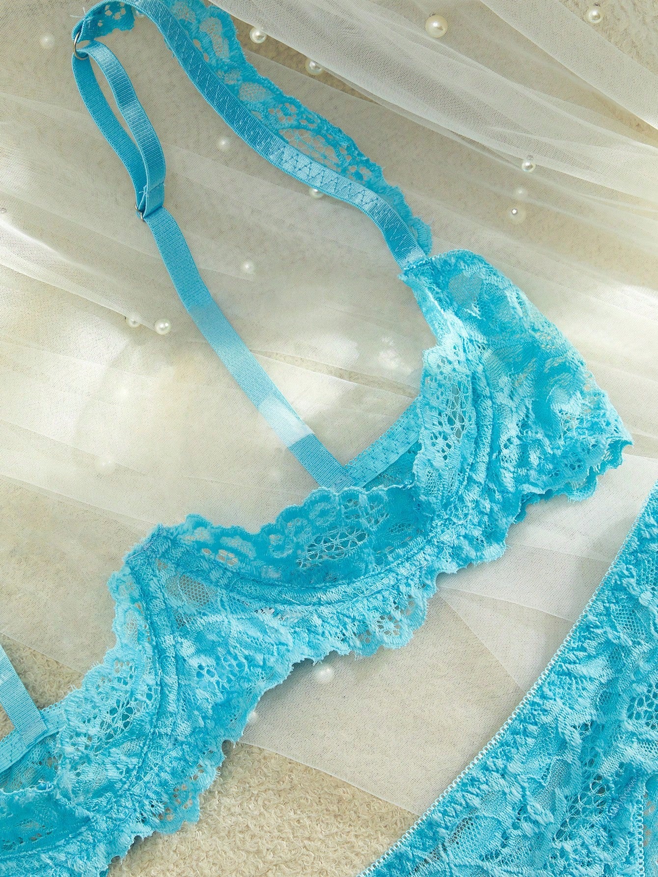 Women's sheer lace underwire bra and thong set with open cup bra, adjustable spaghetti straps, and matching low rise V-string thong in a 2-piece lingerie set.