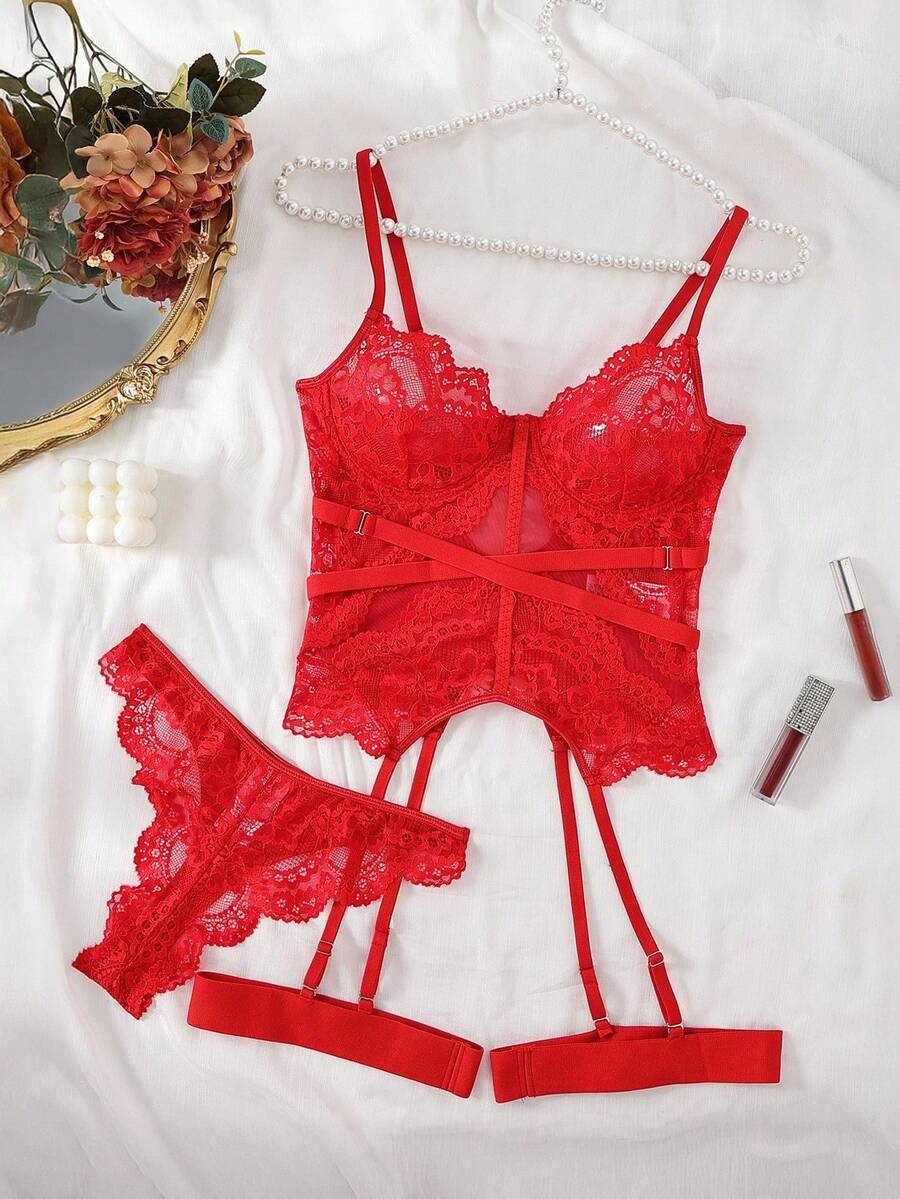 3-piece black lace lingerie set featuring a longline underwire 1/2 cup bra with adjustable spaghetti straps, cut out details, and matching low-rise thong