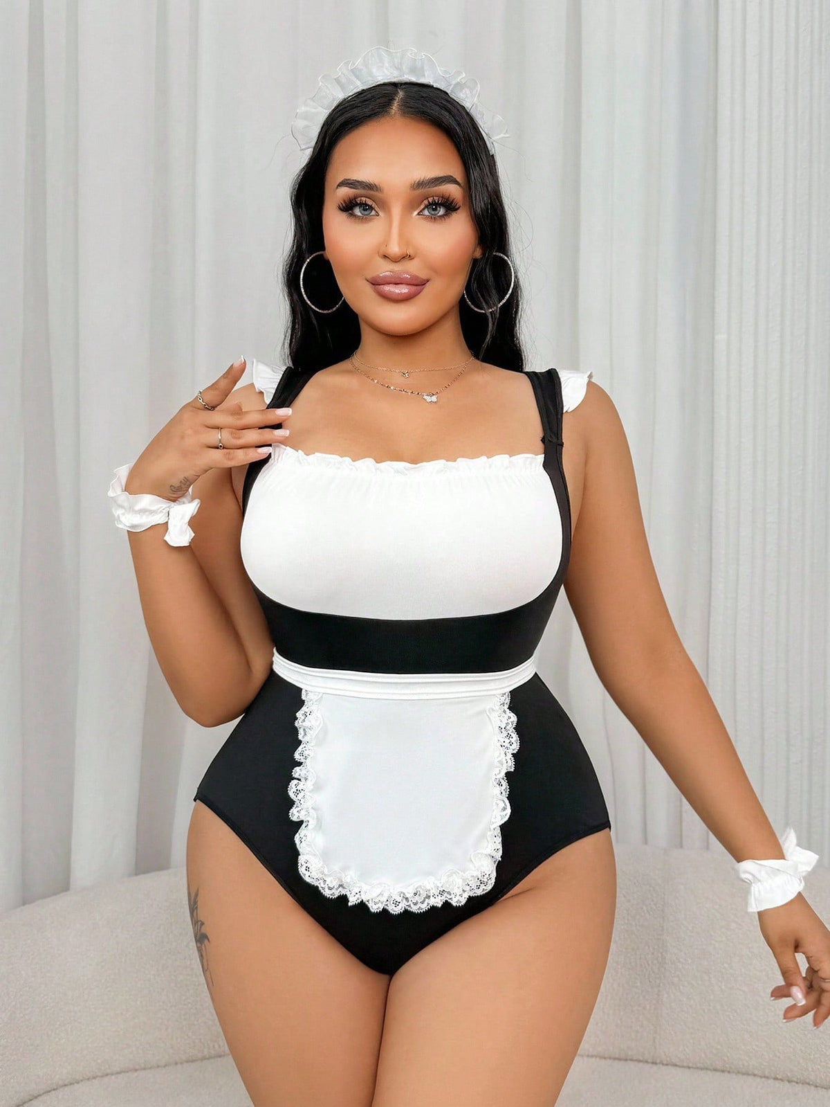 Black and white 5-piece sexy maid costume set featuring a square neck sleeveless bodysuit with frill trim, matching apron, gloves, and headpiece.