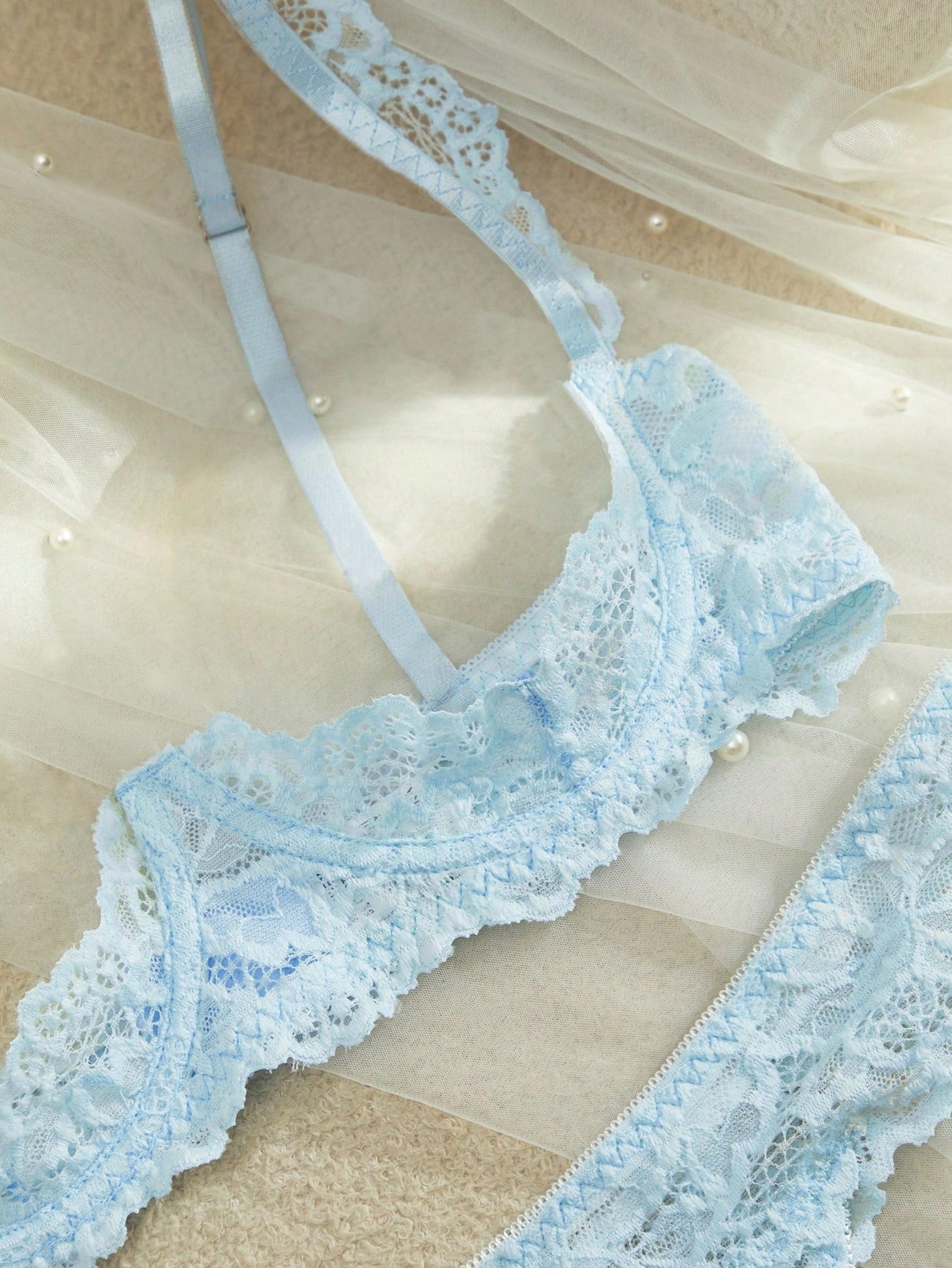 Women's sheer lace underwire bra and thong set with open cup bra, adjustable spaghetti straps, and matching low rise V-string thong in a 2-piece lingerie set.