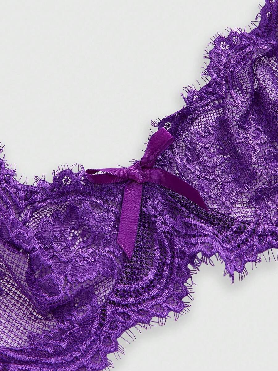 Black sheer floral lace plunge bra featuring underwire support, unlined triangle cups, adjustable straps, and a backless design for women.