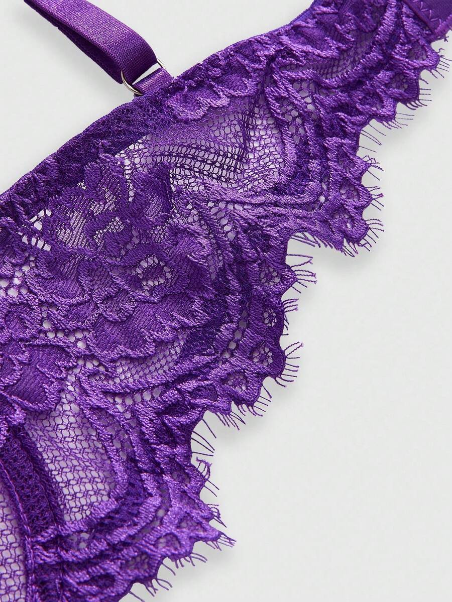Black sheer floral lace plunge bra featuring underwire support, unlined triangle cups, adjustable straps, and a backless design for women.