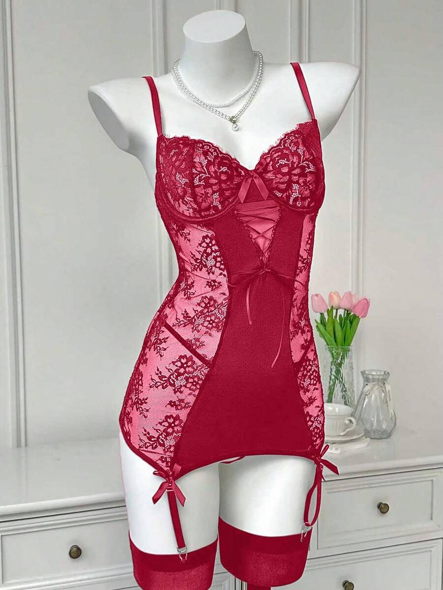 Women's 3-piece sheer black lace nightgown lingerie set featuring a short slip dress with adjustable spaghetti straps, underwire cups, contrast lace patchwork, cut-out details, and a matching low-rise V-string panty.