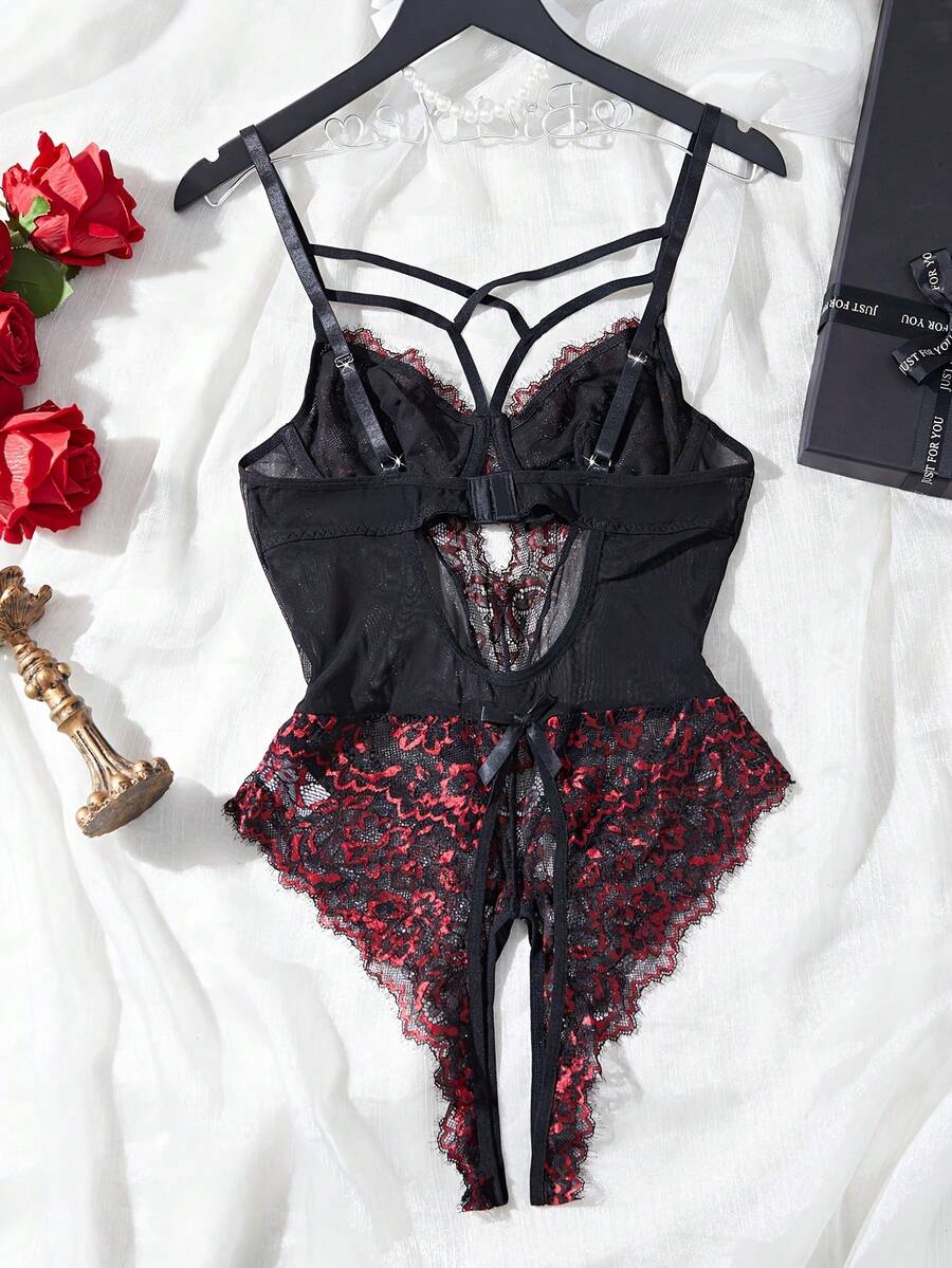 Black sheer lace camisole bodysuit for women featuring floral embroidery, underwire cups, bow details, adjustable spaghetti straps, and a thong bottom.