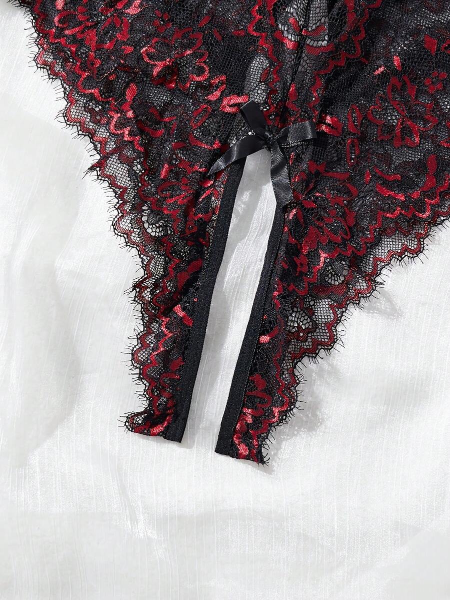 Black sheer lace camisole bodysuit for women featuring floral embroidery, underwire cups, bow details, adjustable spaghetti straps, and a thong bottom.