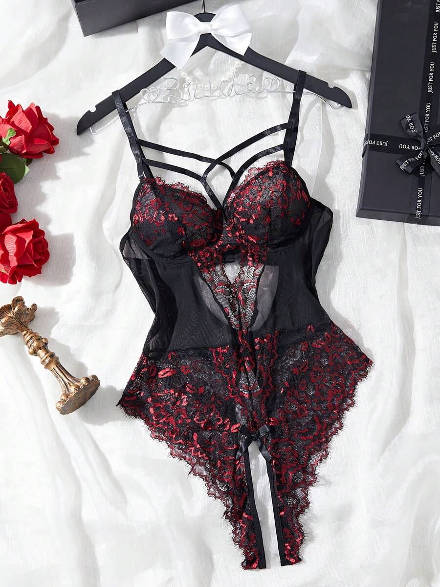 Black sheer lace camisole bodysuit for women featuring floral embroidery, underwire cups, bow details, adjustable spaghetti straps, and a thong bottom.