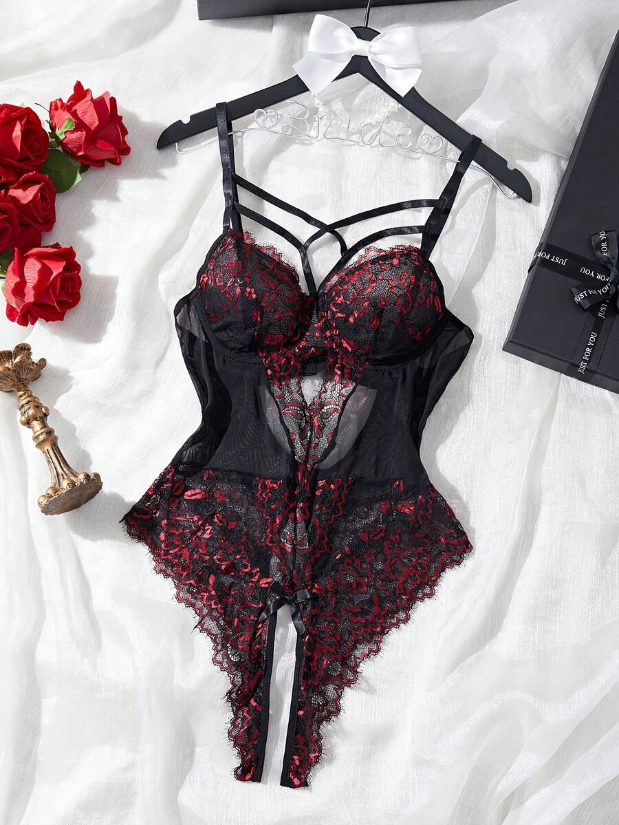Black sheer lace camisole bodysuit for women featuring floral embroidery, underwire cups, bow details, adjustable spaghetti straps, and a thong bottom.