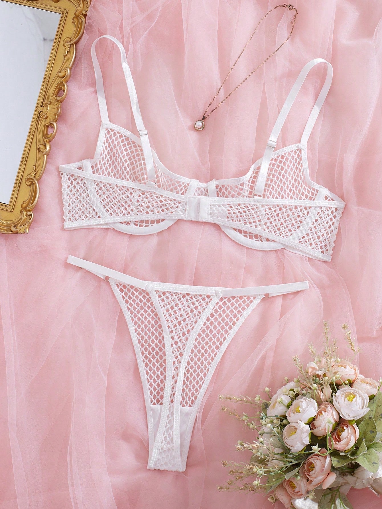 Women's 2-piece mesh lingerie set with hollow out detail, underwire bra, adjustable spaghetti straps, and matching low-rise thong panties in a sheer plain design.