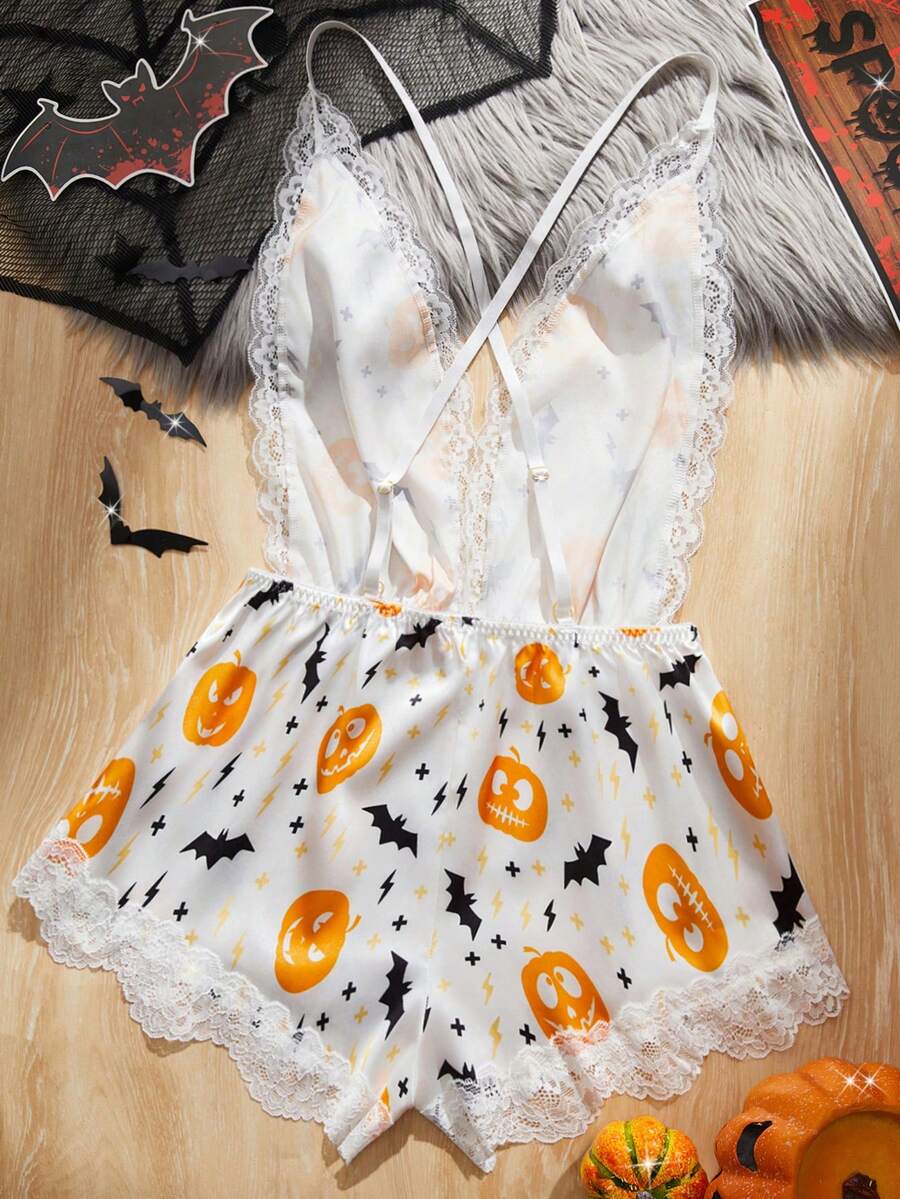 Women's Halloween satin jumpsuit sleepwear with pumpkin lantern and bat print, backless contrast lace design, and adjustable straps.