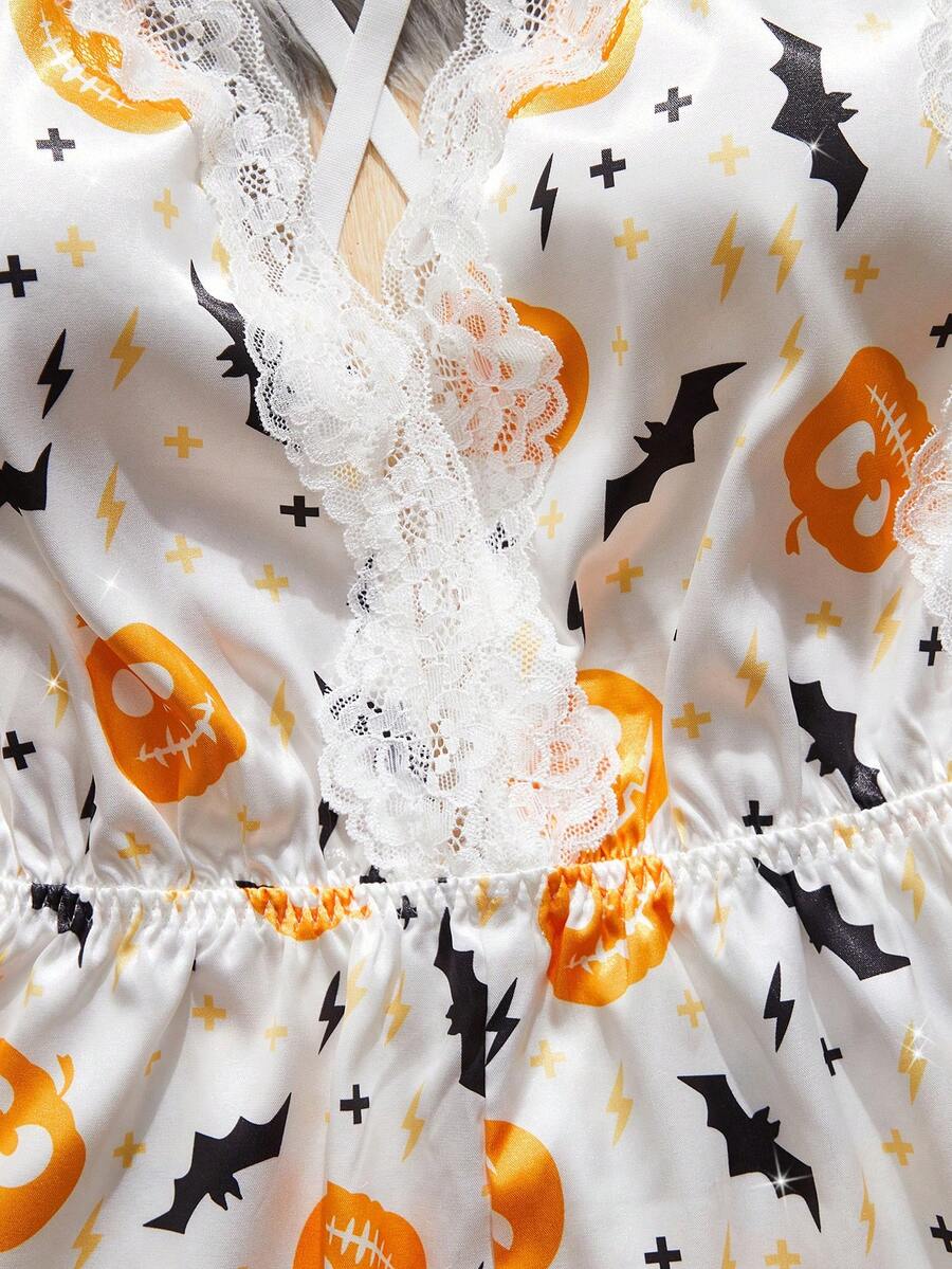 Women's Halloween satin jumpsuit sleepwear with pumpkin lantern and bat print, backless contrast lace design, and adjustable straps.