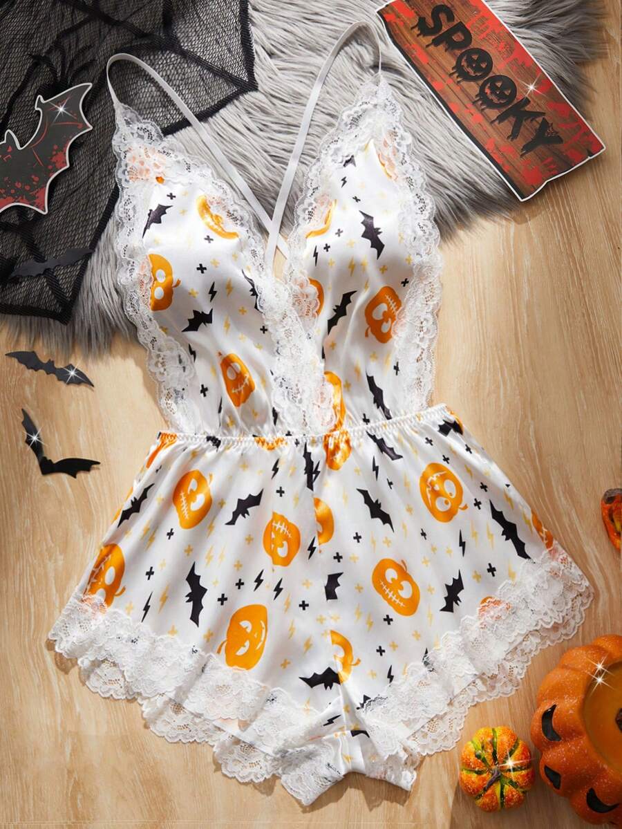Women's Halloween satin jumpsuit sleepwear with pumpkin lantern and bat print, backless contrast lace design, and adjustable straps.