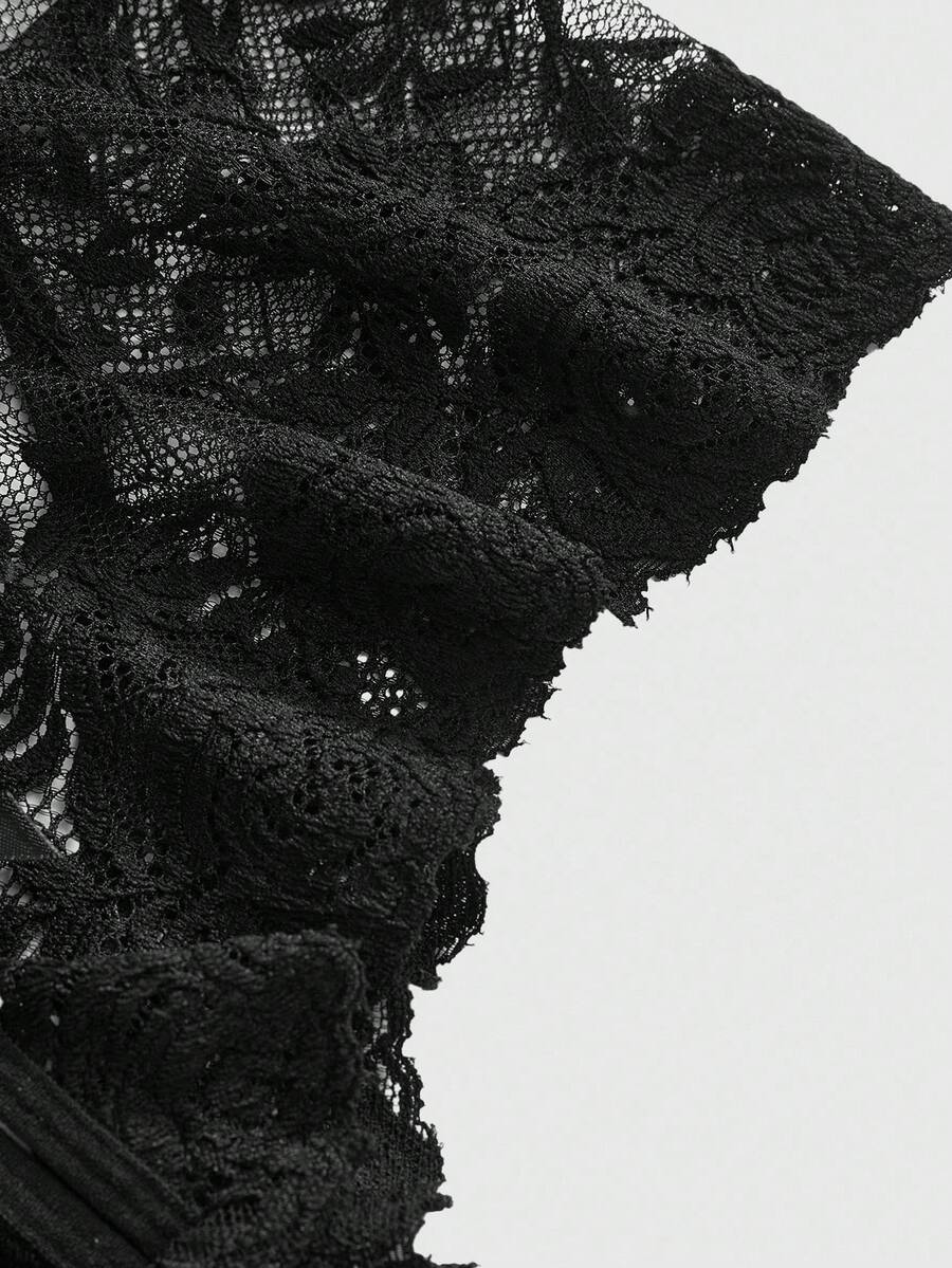 Black lace crotchless panties featuring a gothic hollow heart cutout design in sheer mid-rise fabric for women.