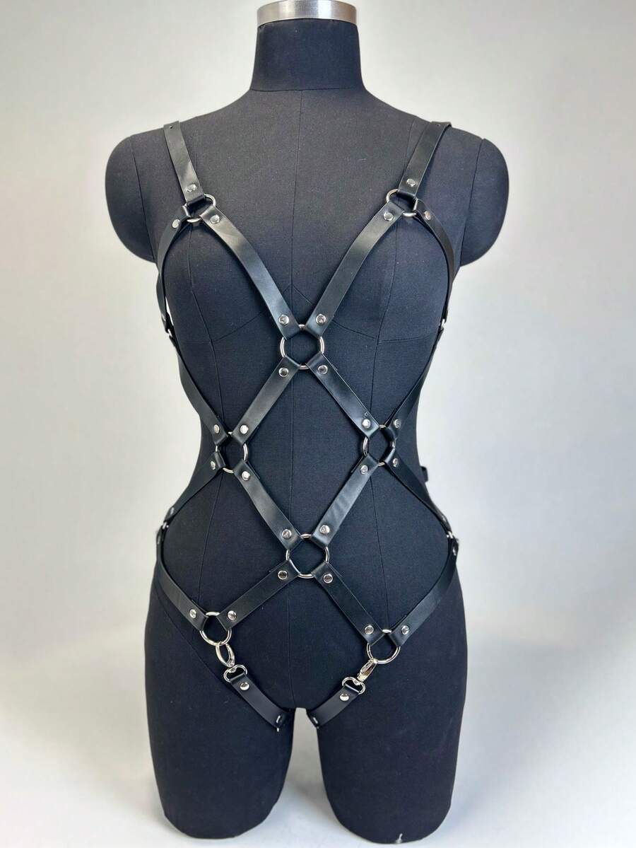 Black PVC leather harness lingerie set for women featuring ring details, restraint straps, thigh garters, and goth Y2K style.