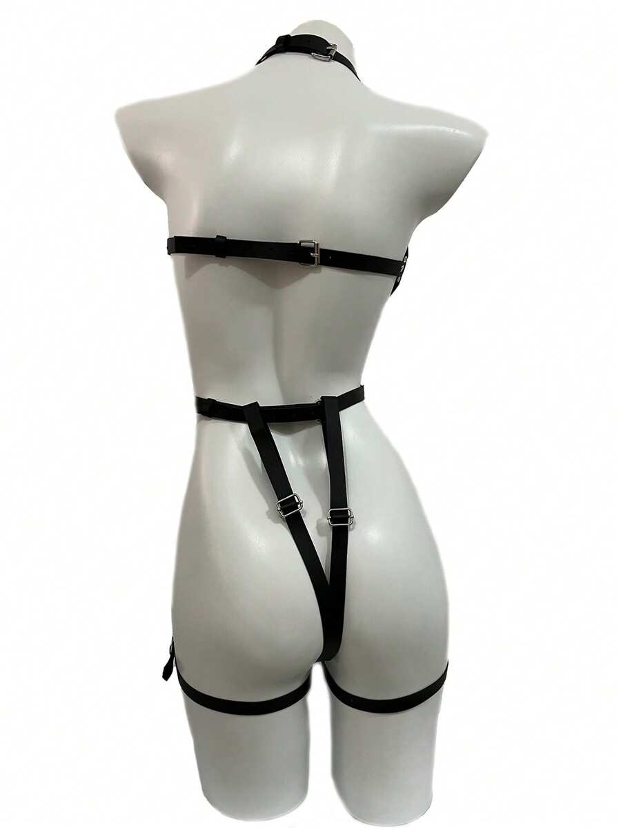 Black PVC leather harness lingerie set for women featuring ring details, restraint straps, thigh garters, and goth Y2K style.