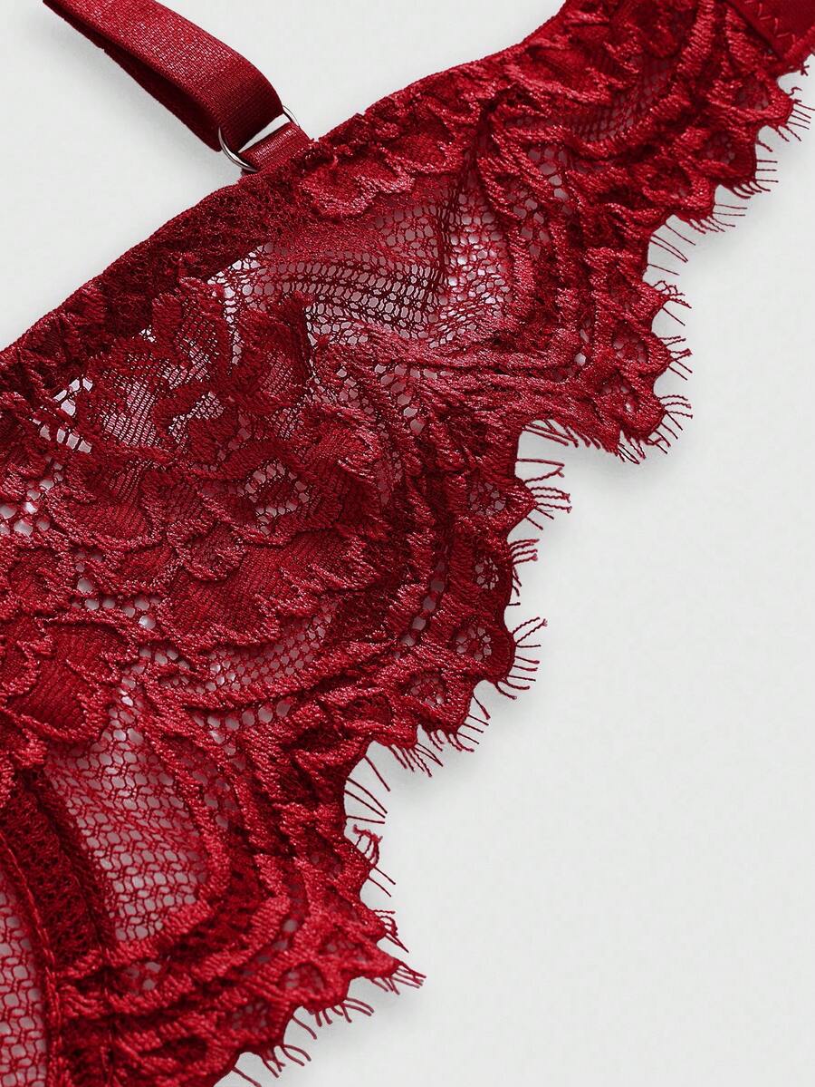Black sheer floral lace plunge bra featuring underwire support, unlined triangle cups, adjustable straps, and a backless design for women.