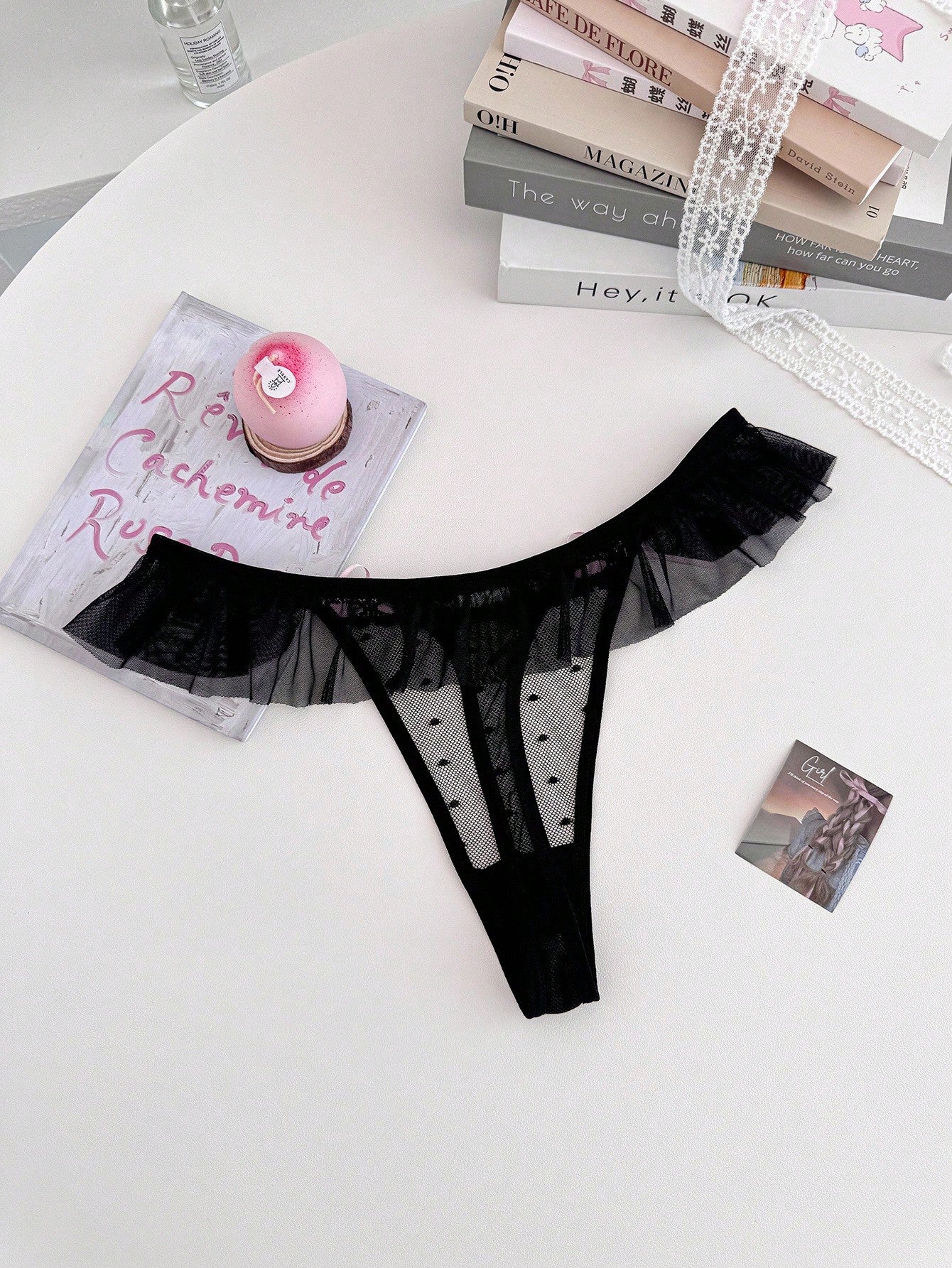 Women's ruffled mesh thong panty with bow detail and mid rise fit, plain design, 1-piece style
