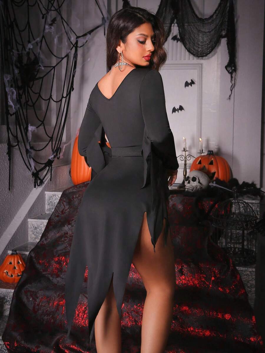 Black long sleeve Halloween costume mini dress with scoop neck, asymmetrical split hem, and waist belt on a woman.