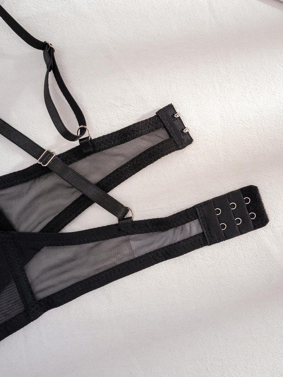 Black sheer 2-piece lingerie set for women featuring a backless underwire bra with clear straps and a matching low-rise thong.